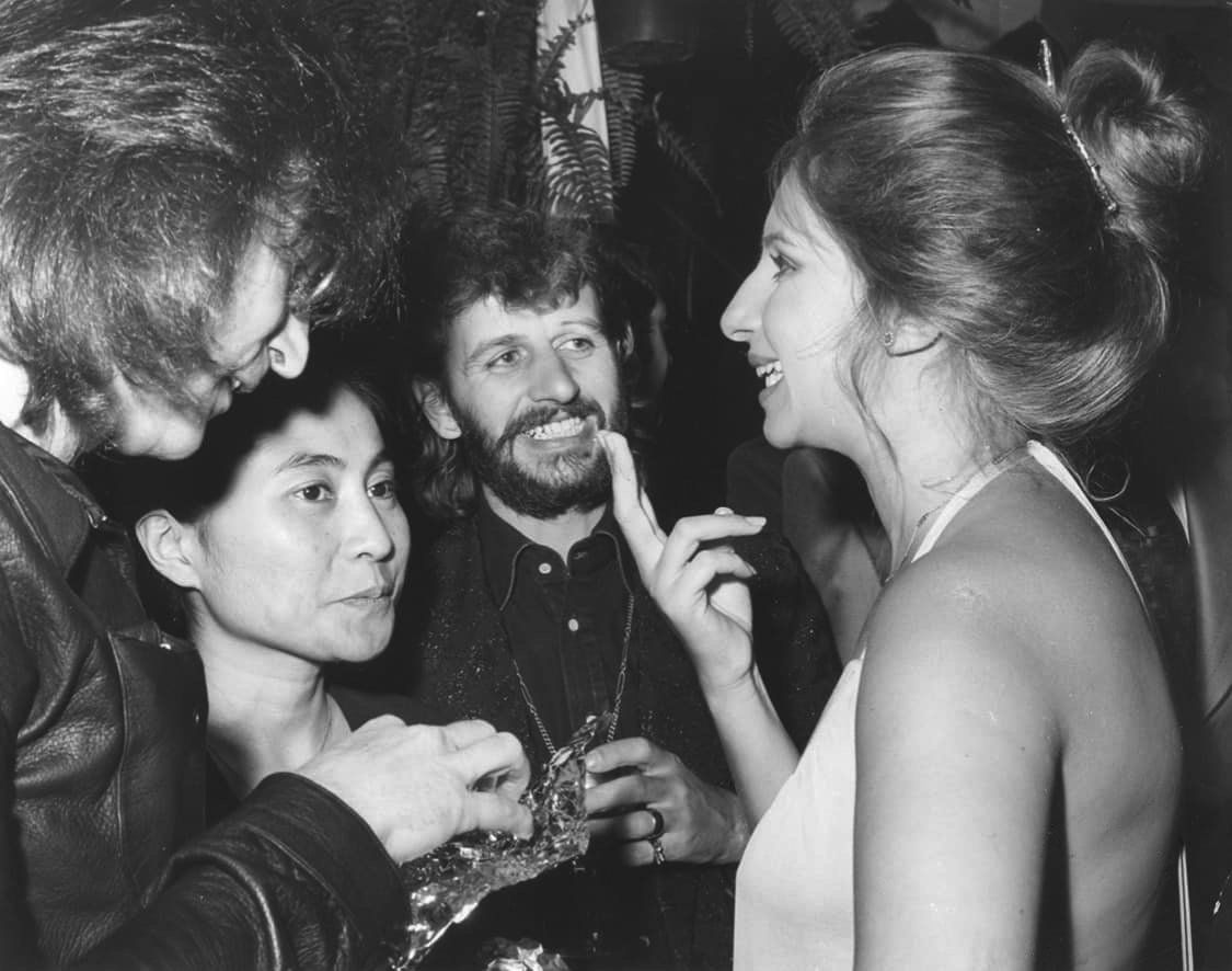 John Lennon, Yoko Ono, and Ringo Star talk to Streisand at the event.