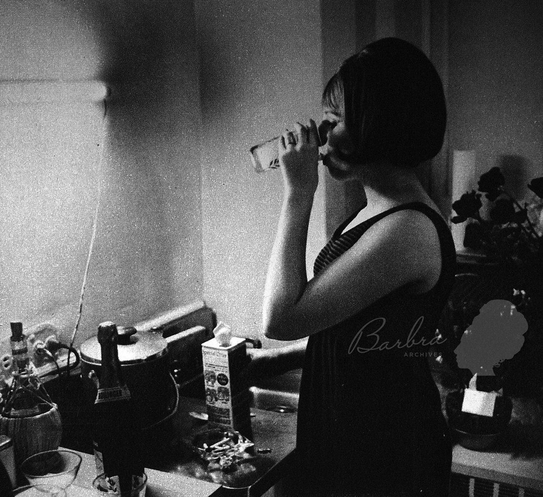 Streisand drinks a coke in her dressing room