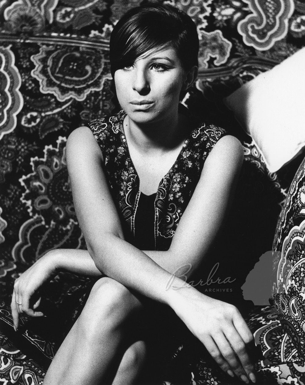 Streisand wears paisley in her paisley wallpapered dressing room.