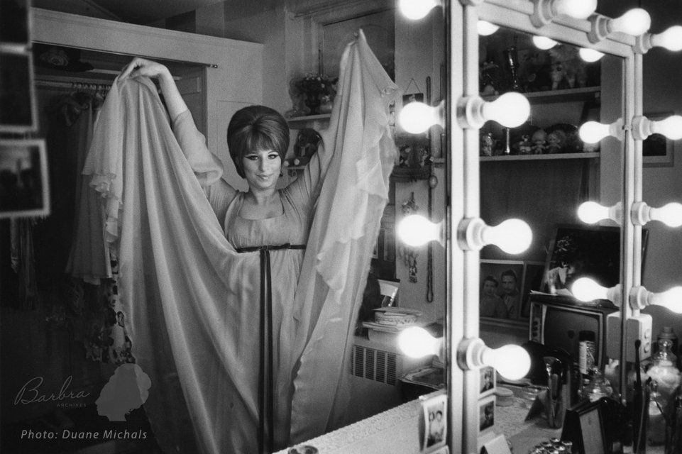Streisand displays her chiffon gown in her Funny Girl dressing room.