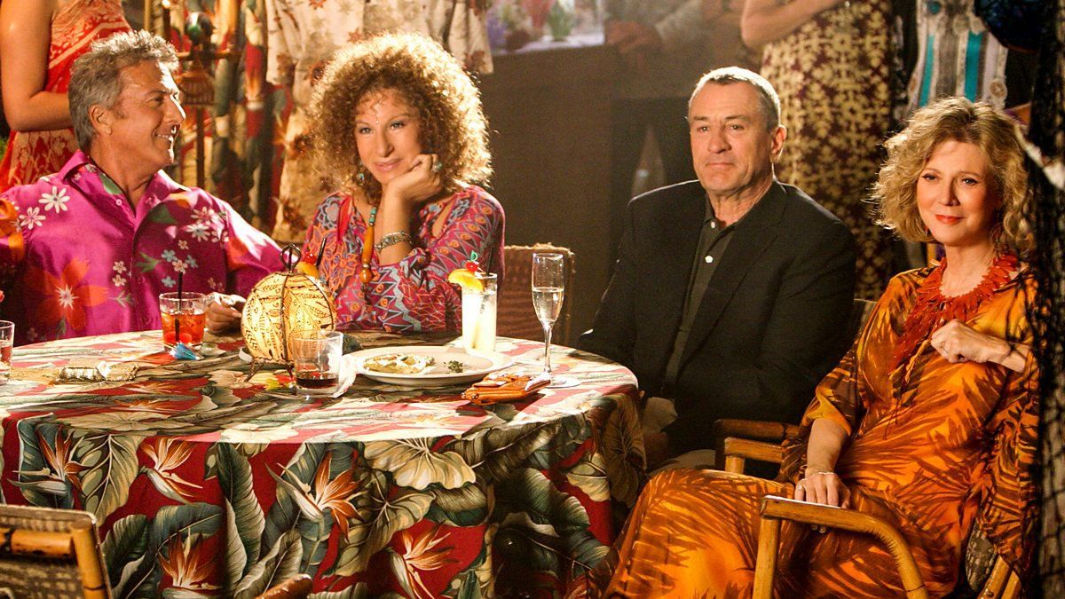 Hoffman, DeNiro and Danner sitting with Streisand in a party scene from Meet The Fockers