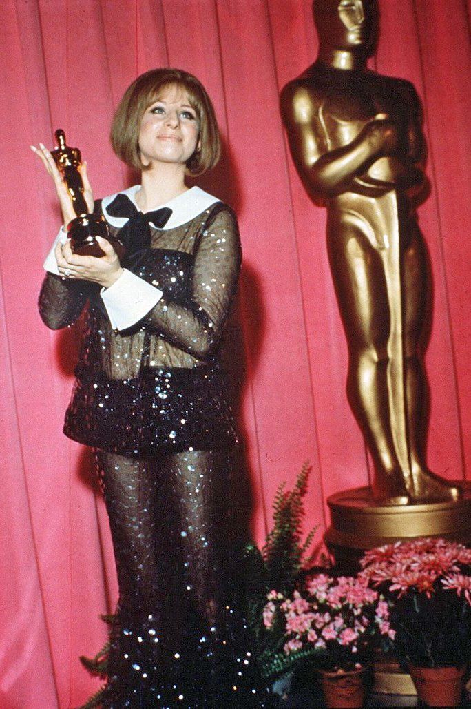Streisand holding her Oscar, 1969.