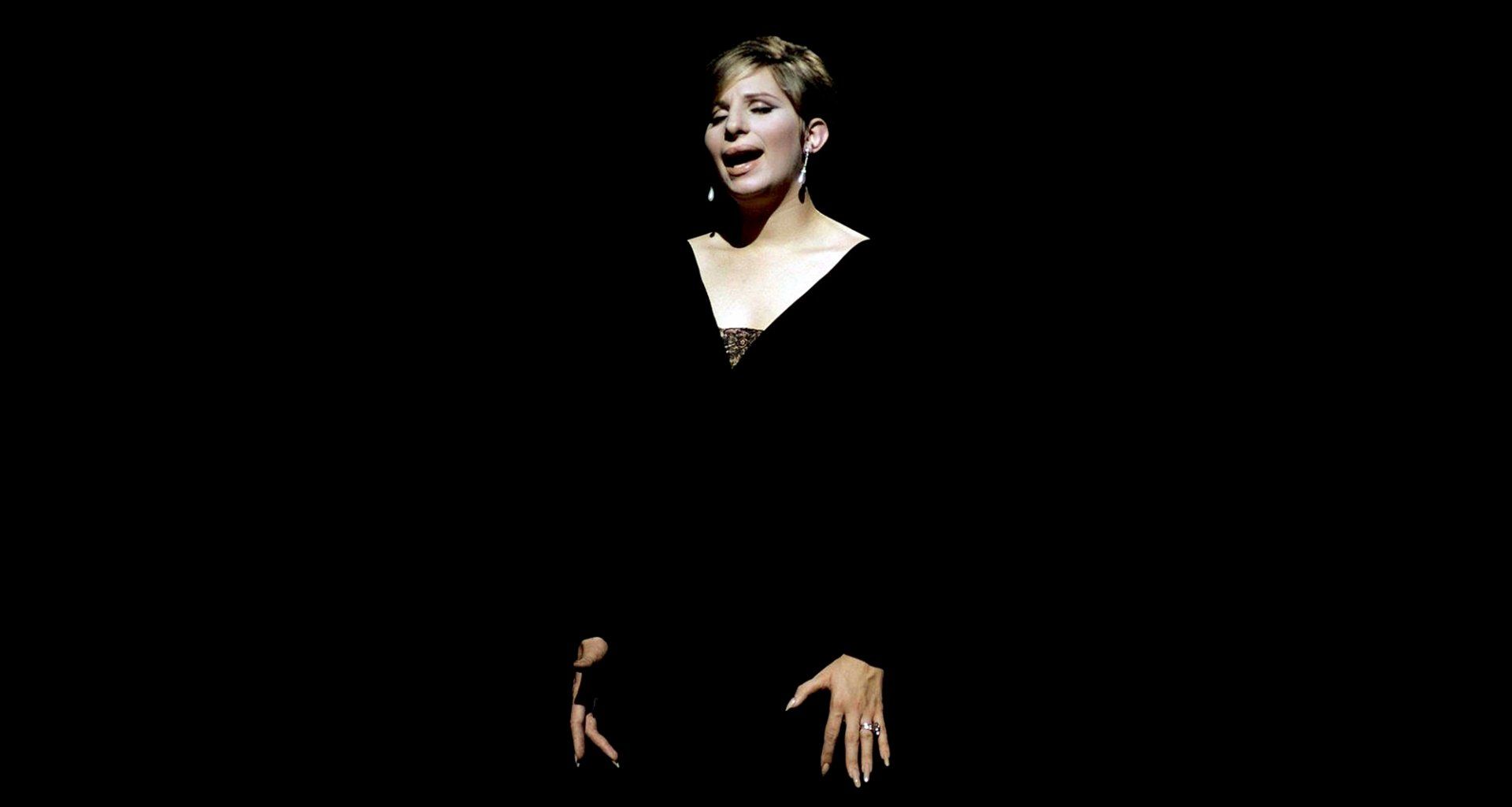 Streisand, in black, sings My Man