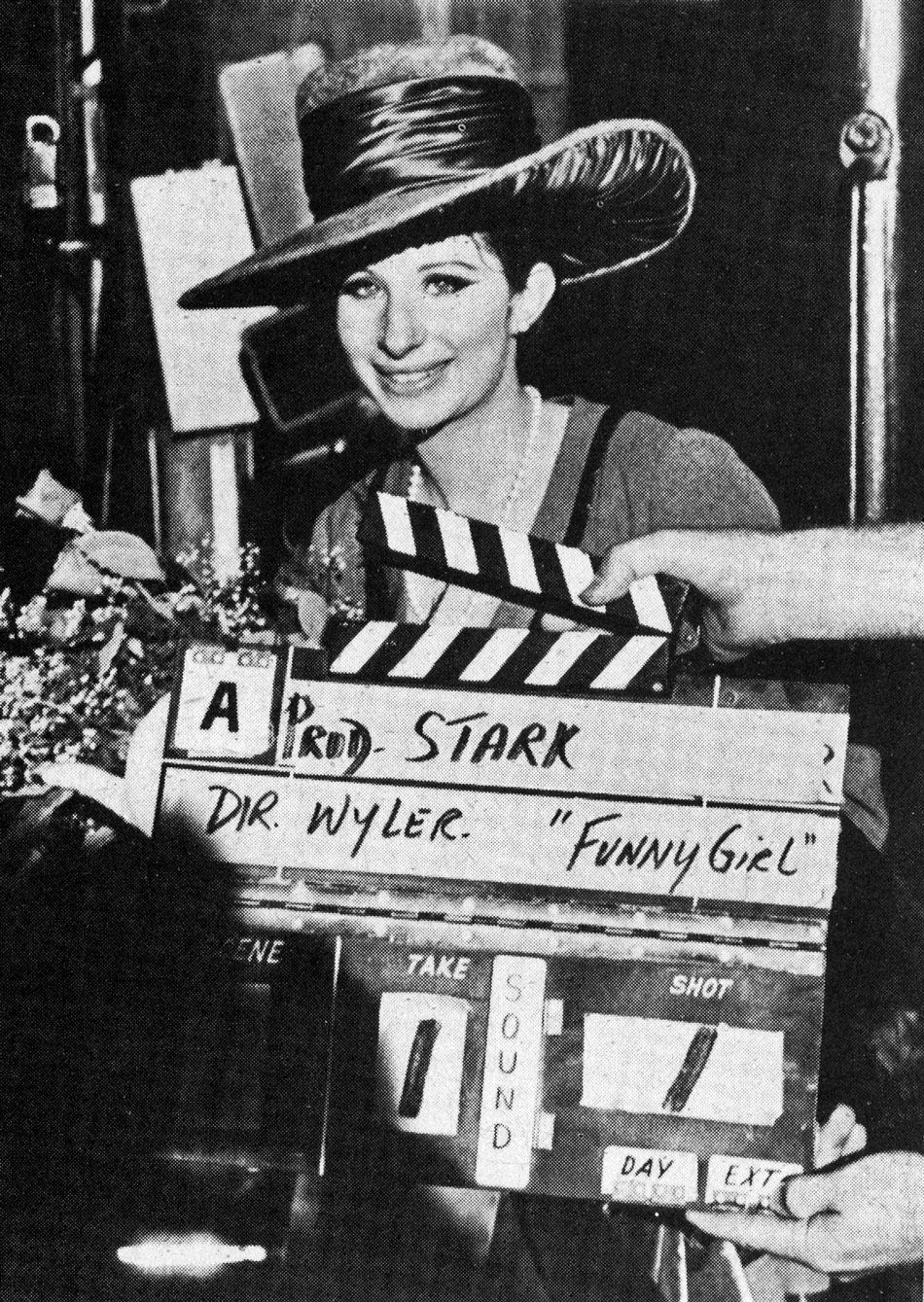Streisand on set the first day. The clapperboard reads: Take 1, Shot 1.