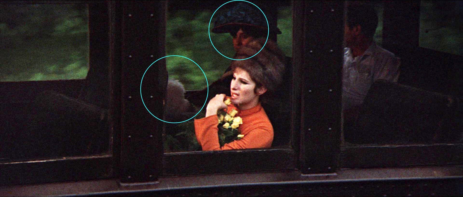 Frame of Streisand on train, filmed by helicopter.