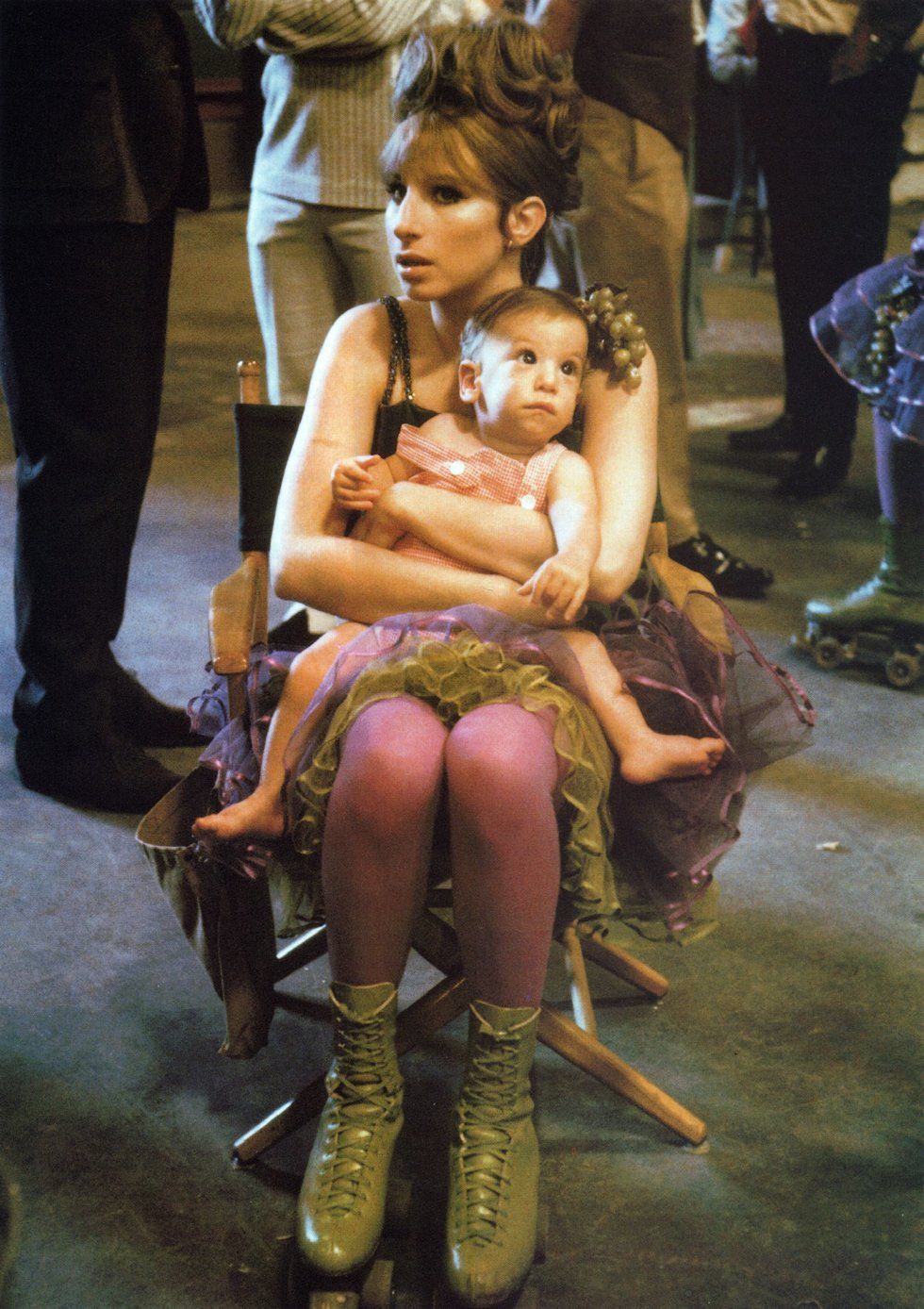 BARBRA STREISAND holds her son, Jason Gould, on the set of Funny Girl, 1967.