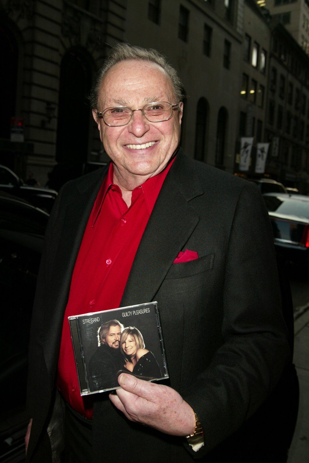 Marty Erlichman holds the Guilty Pleasures CD.