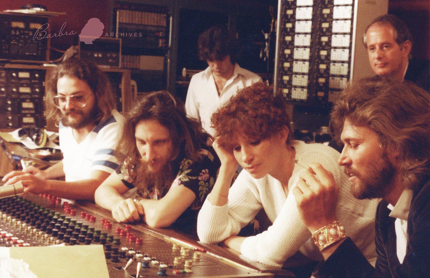 Streisand and Barry Gibb mixing in the recording studio.