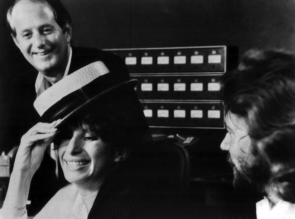 Streisand laughs in the studio with Barry Gibb.