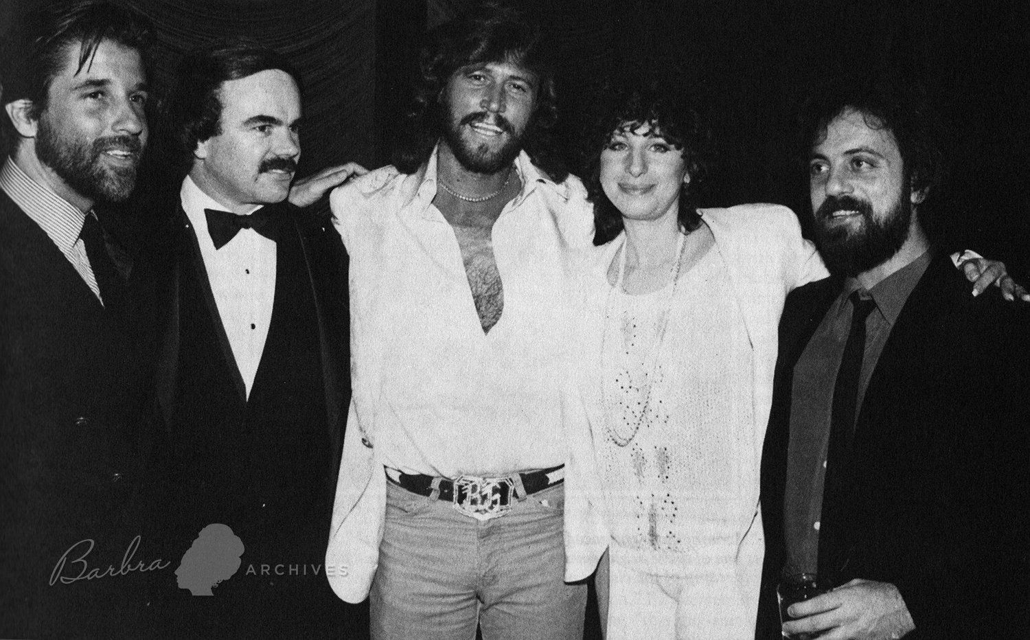 Jon Peters, unidentified, Barry Gibb, Streisand and Billy Joel  celebrate their Grammy win at the Four Seasons Hotel, 1981.