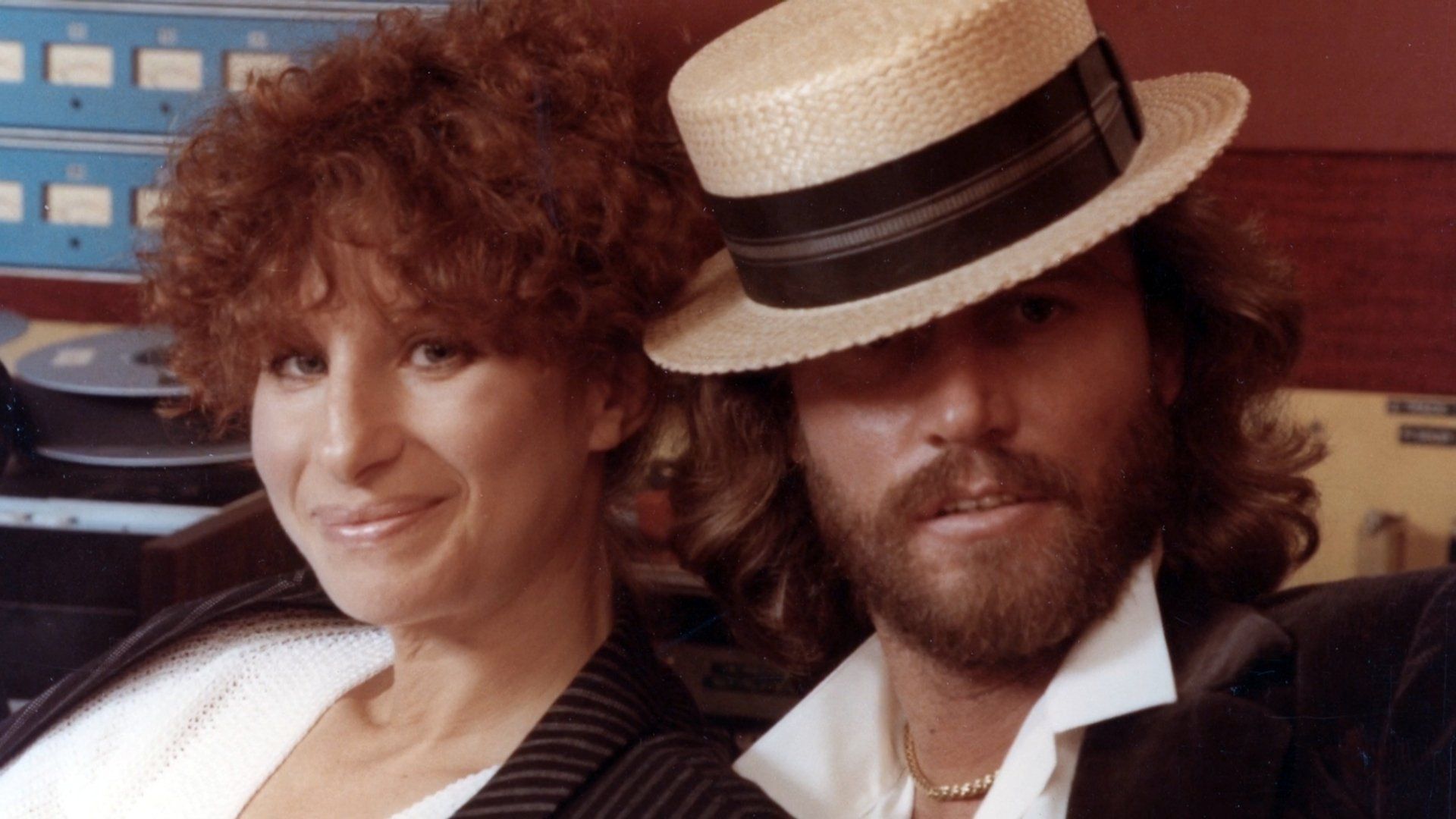 Barbra Streisand and Barry Gibb (in straw hat).