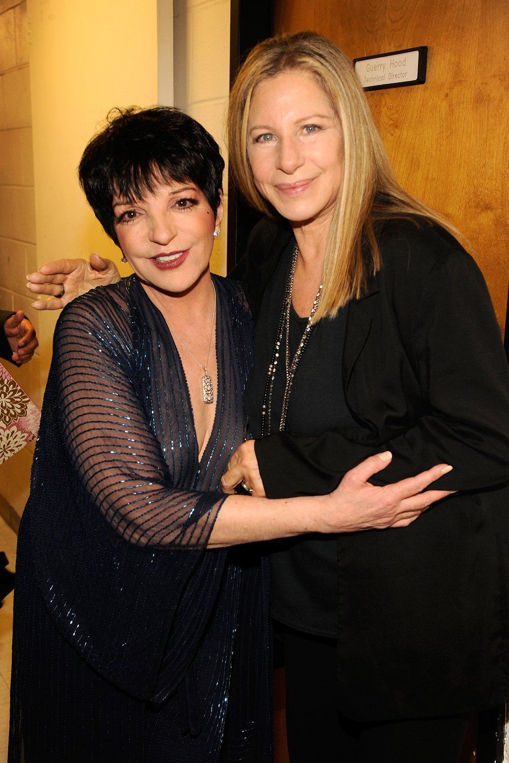 Liza Minnelli and Barbra Streisand pose backstage at the Marvin Hamlisch memorial concert.