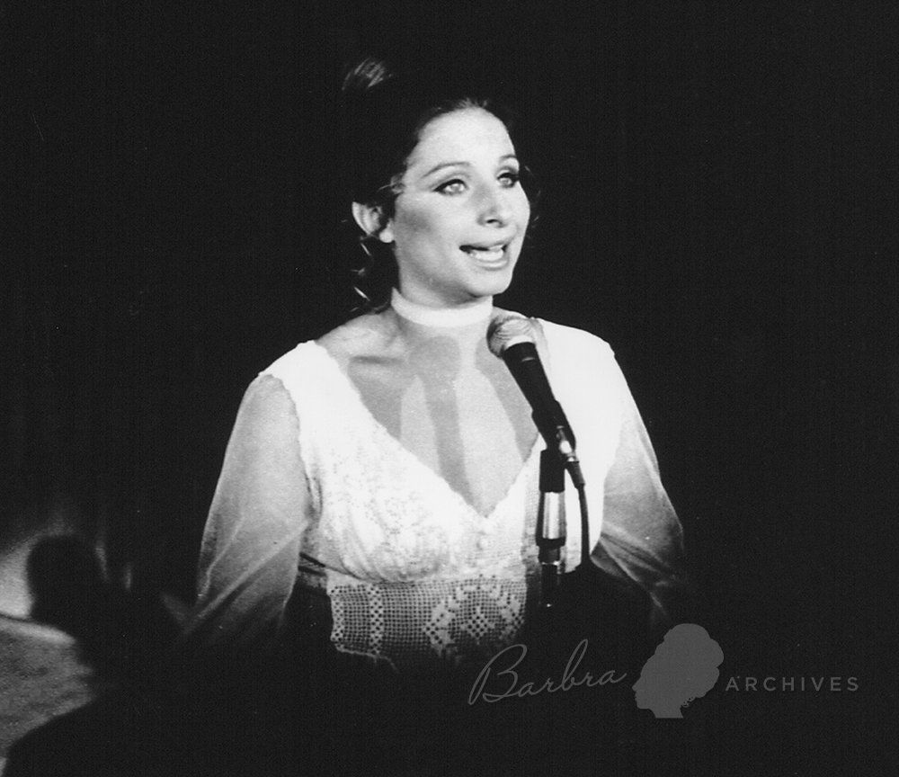 Streisand in a lace a velvet gown she designed herself.