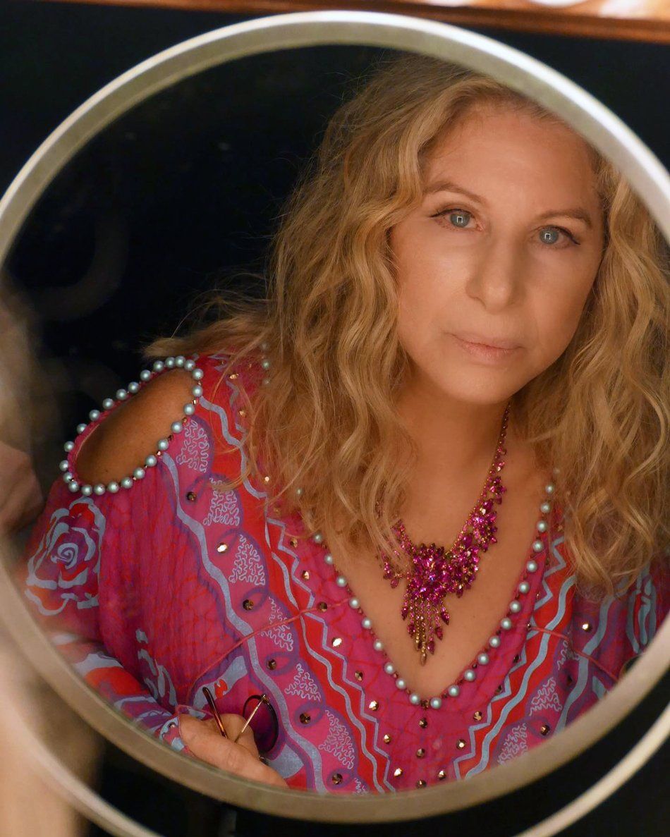 Streisand backstage, looking in mirror.