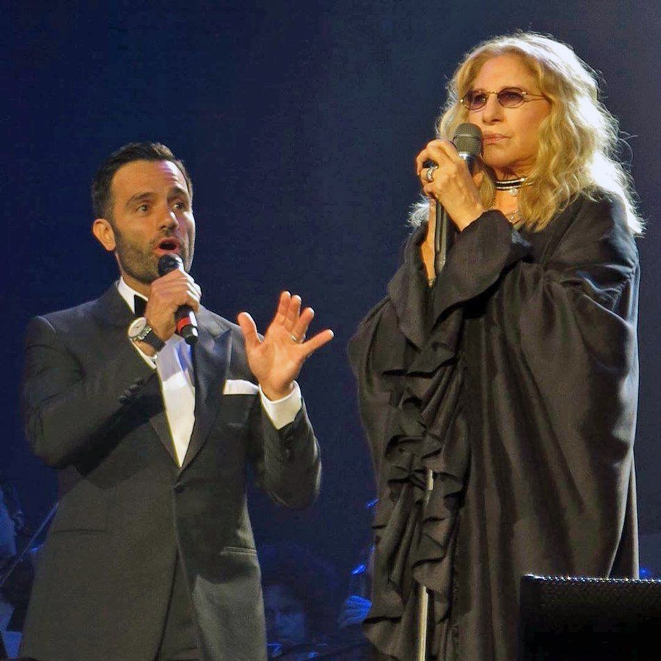 Ramin Karimloo and Barbra Streisand in black dress.