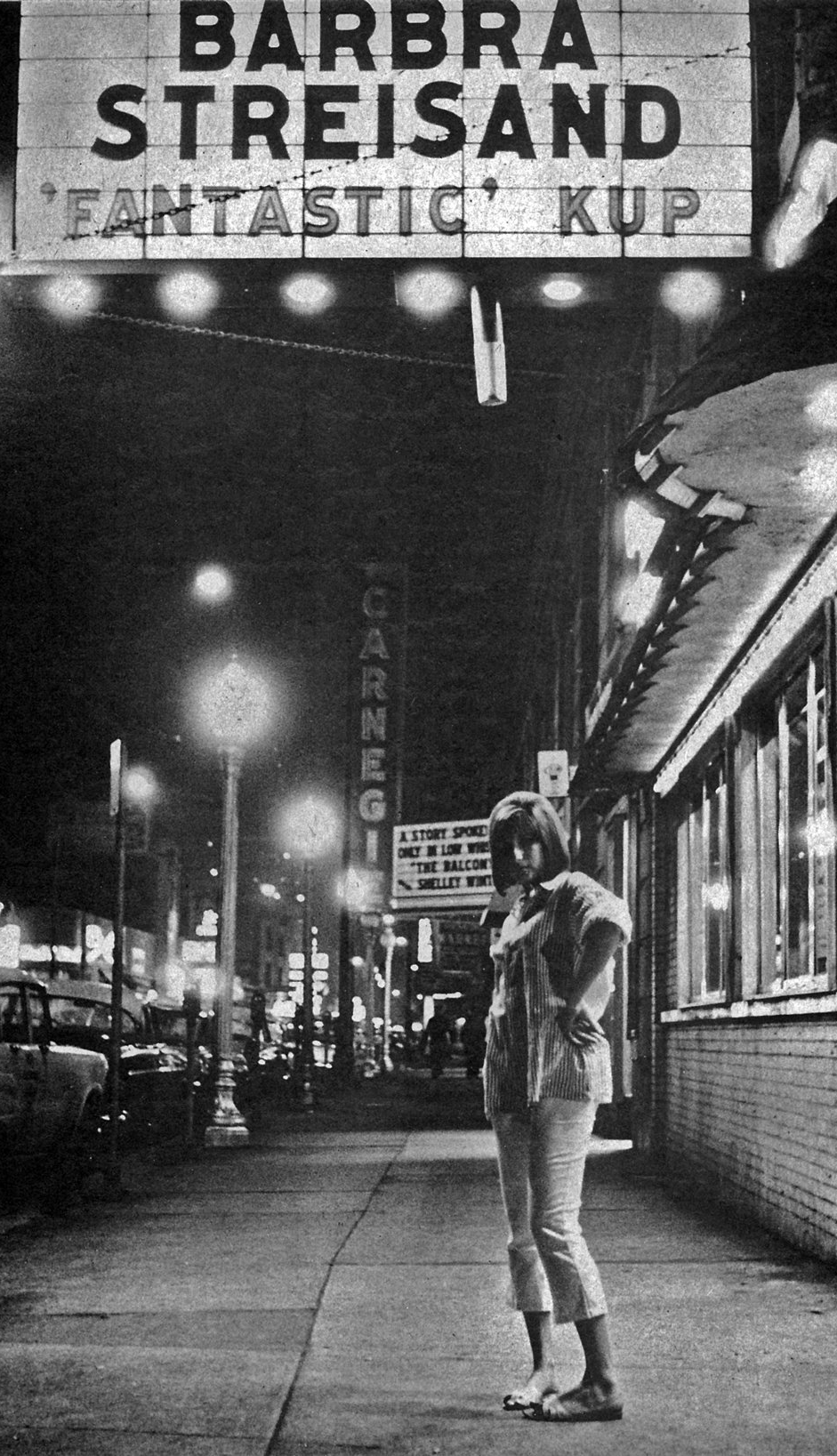 Barbra Streisand standing outside Mr. Kelly's in Chicago in 1963.