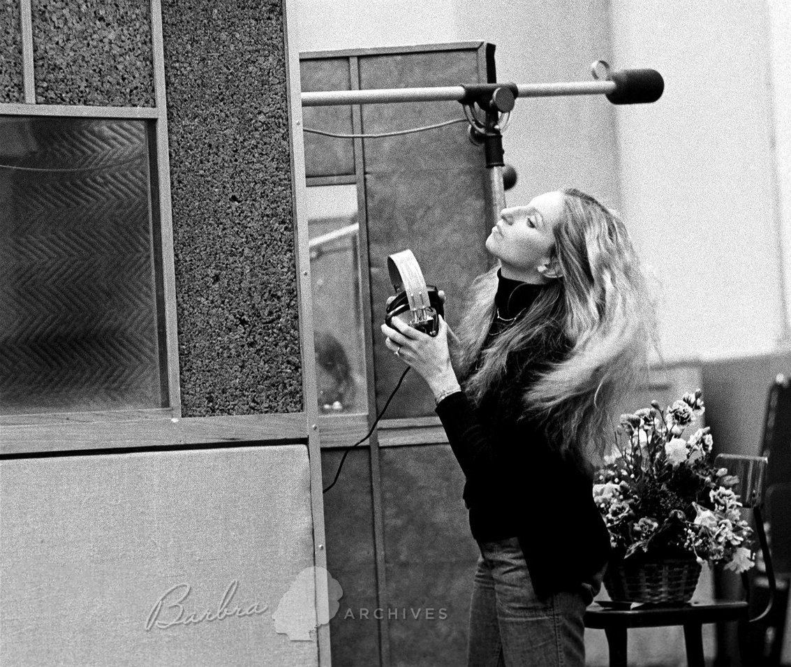 Barbra Streisand with headphones while recording the Lazy Afternoon album