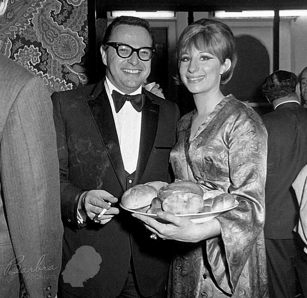 Marty Erlichman and Streisand at Funny Girl's opening night party on Broadway.  She's a bagel on a plateful of onion rolls!