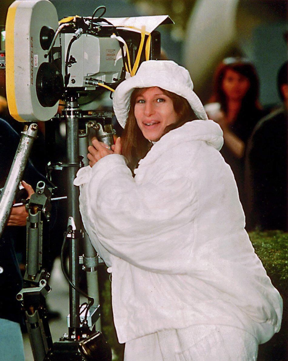 Streisand, dressed in warm clothes, on the New York location of THE MIRROR HAS TWO FACES.