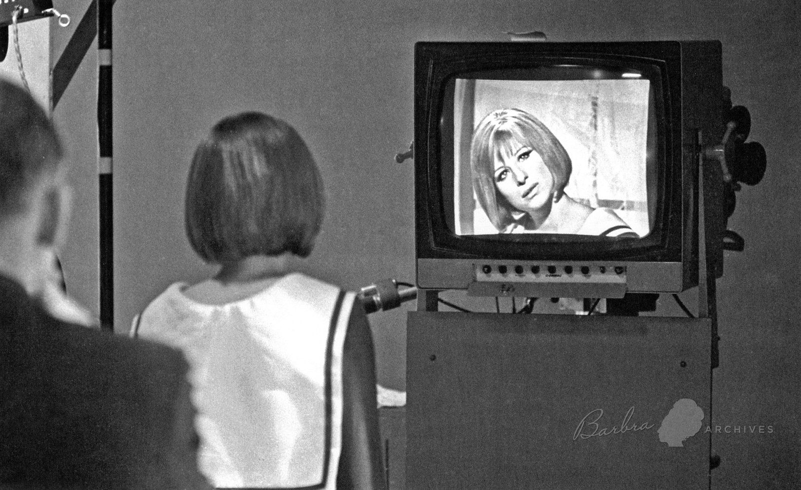 Streisand watches video playback for a scene that was just taped in the CBS soundstage.