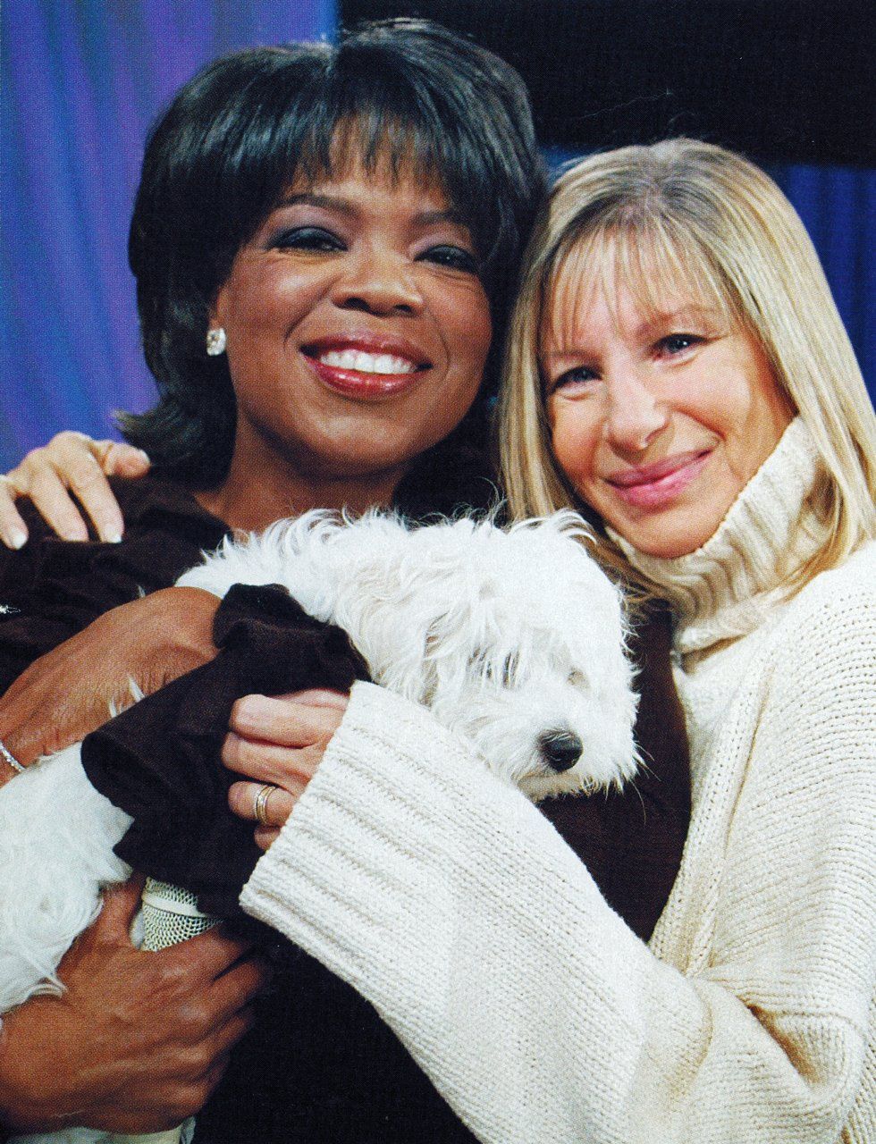 Oprah and Barbra pose with Barbra's dog, Sammie.