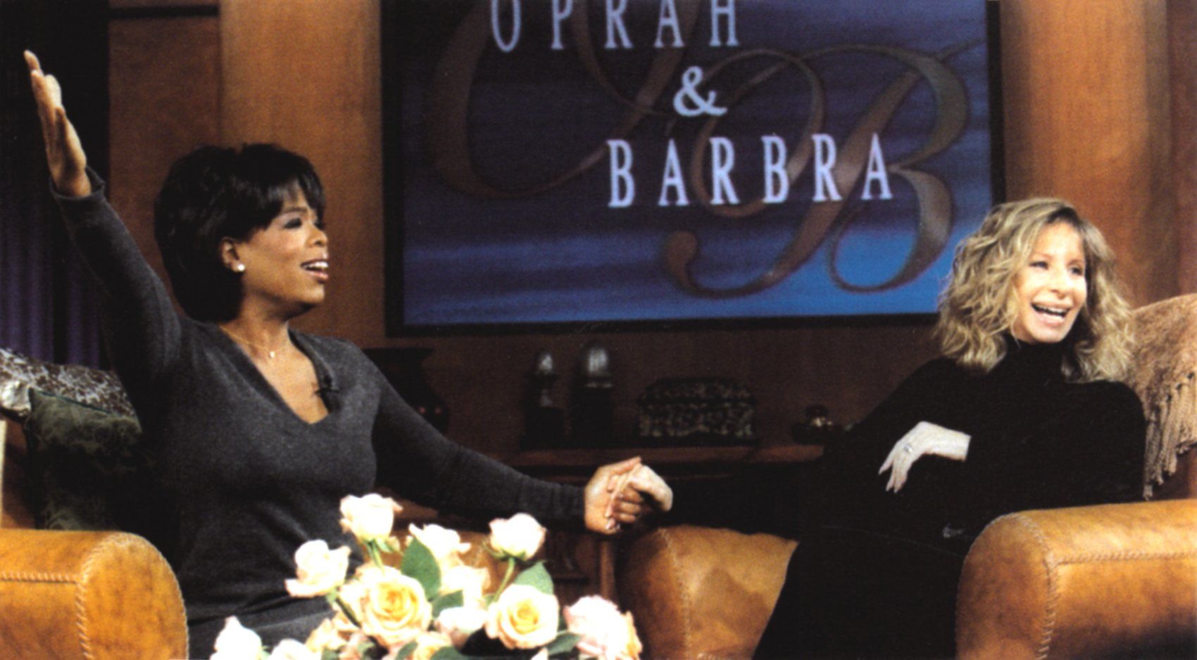 Oprah Winfrey welcomes Barbra Streisand on her show in 1996.