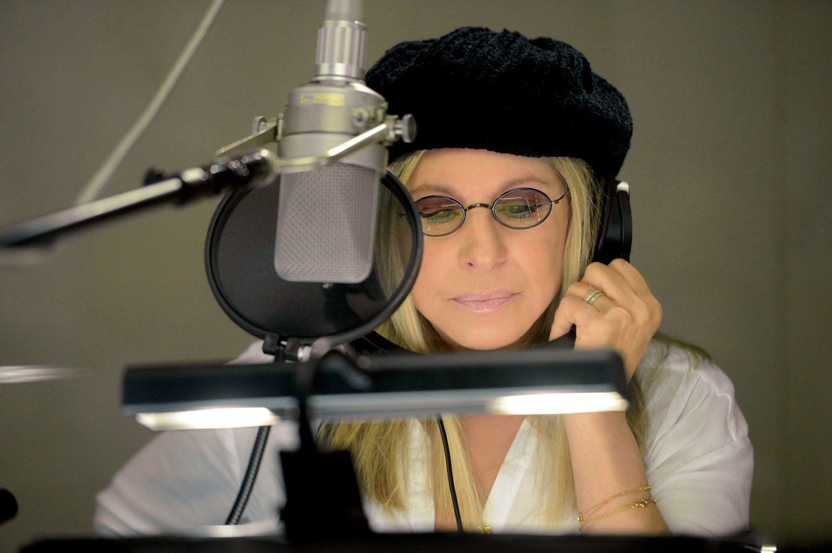 Streisand at the microphone, recording the Partners album.