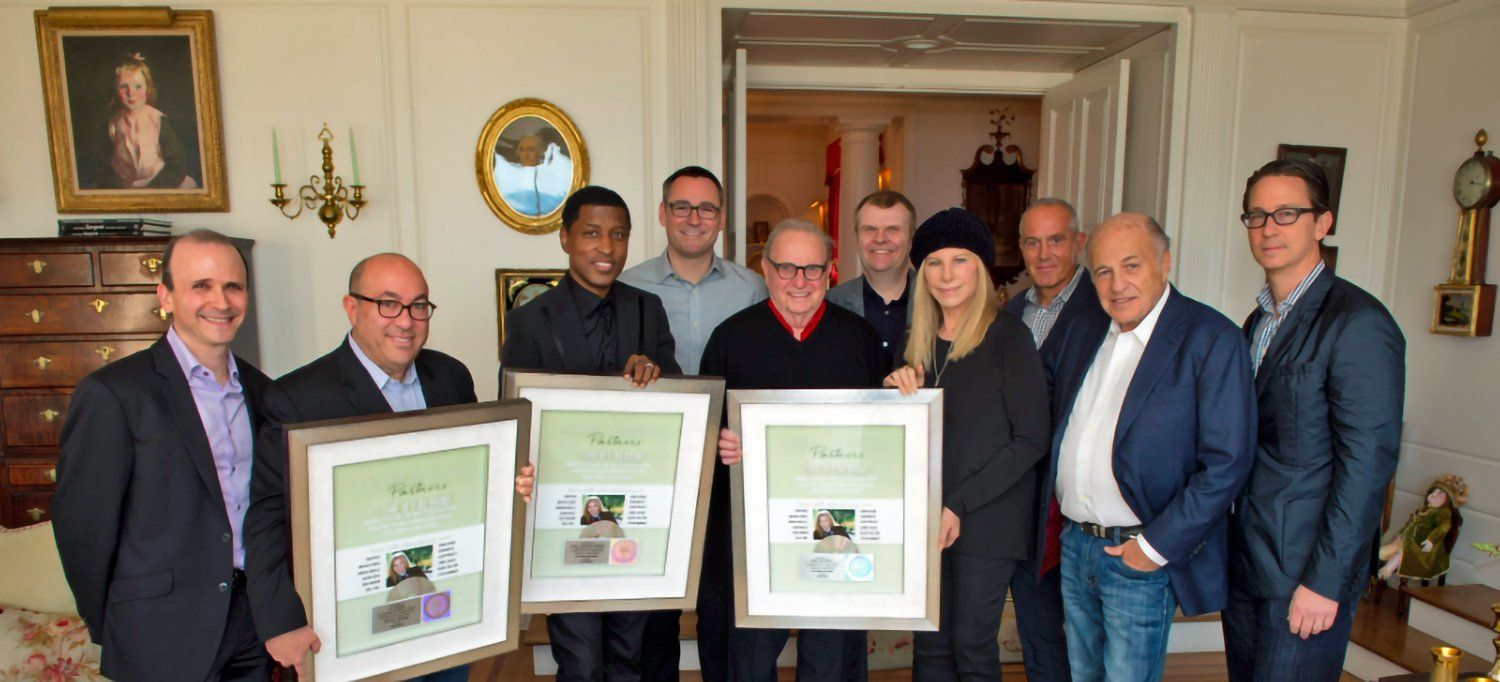 Streisand and team holding Number One Album awards