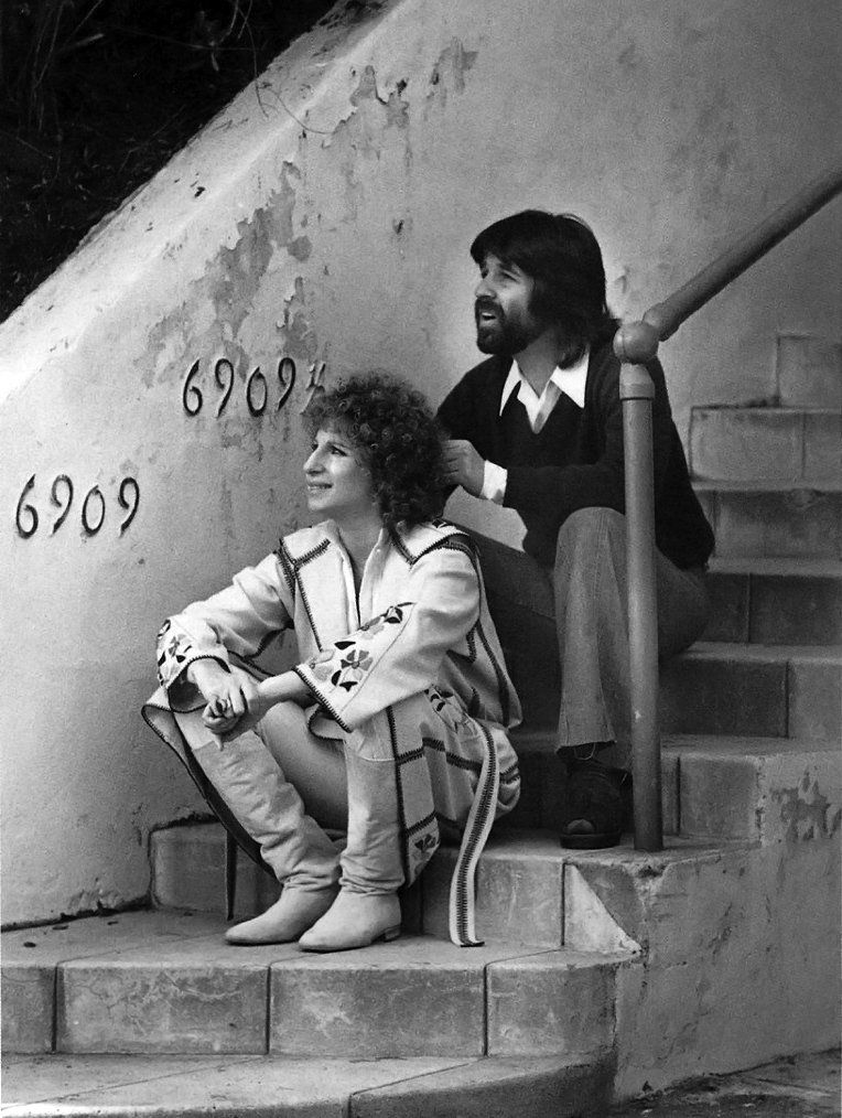 Streisand and Jon Peters at the location of Esther's apartment in the film.
