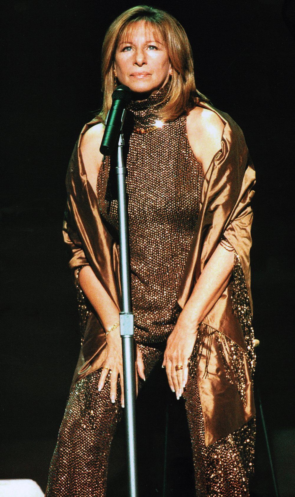 Streisand wearing copper-colored version of the Las Vegas first act pantsuit.