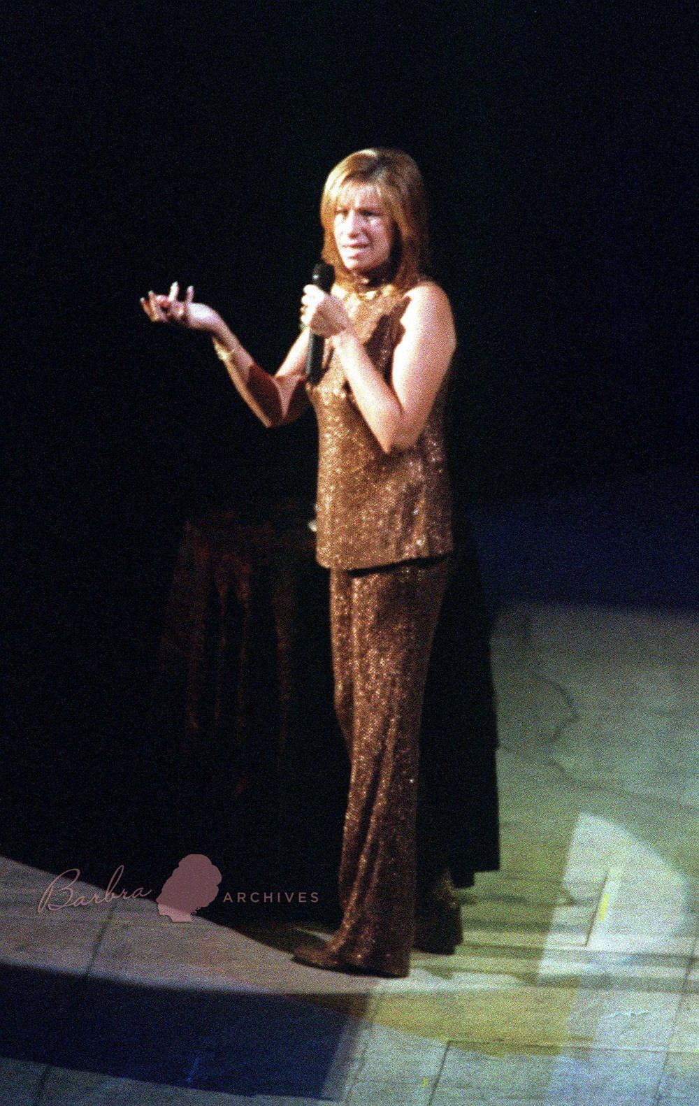 Streisand in New York wearing copper-colored version of her first act pantsuit.