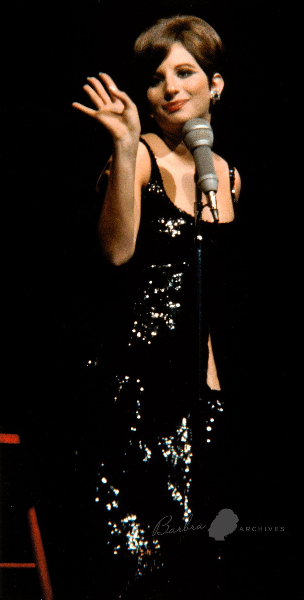 Barbra Streisand in black sparkly dress in concert in 1966