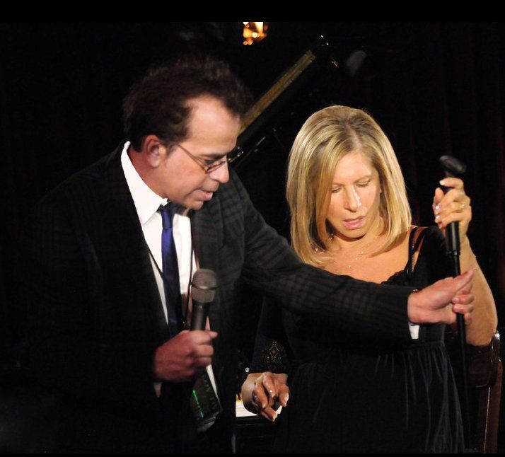 Richard Jay-Alexander and Barbra Streisand handle the not-cordless microphone.