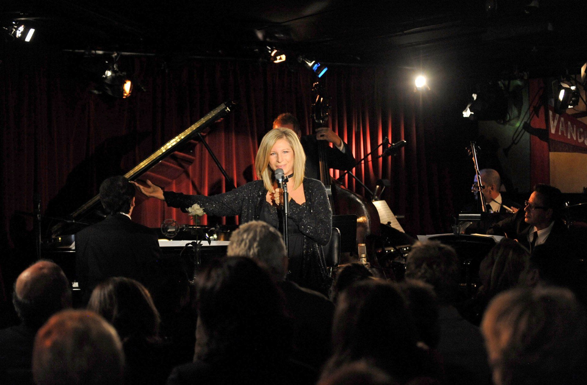 Streisand welcomes the audience to the Village Vanguard