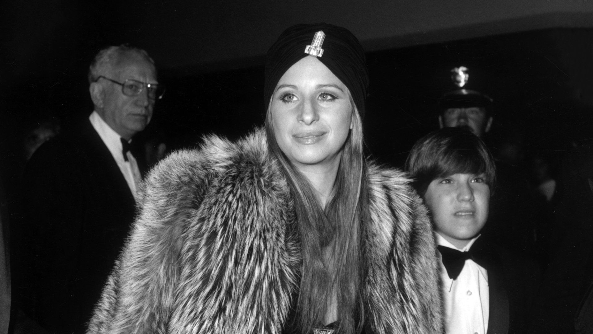 Streisand in grey fur at the premiere of The Way We Were