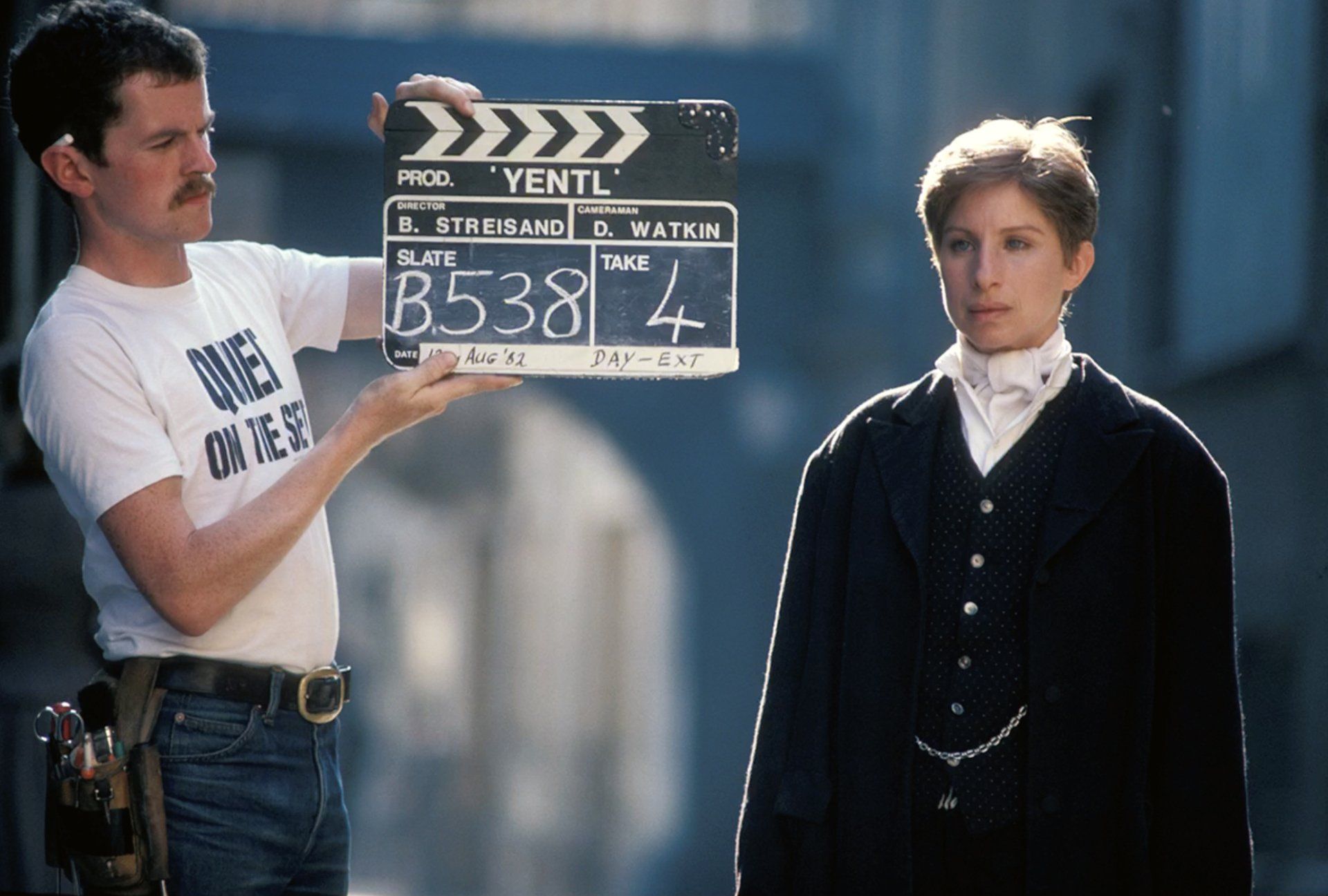 Barbra Streisand in front of the clapperboard, filming Yentl.
