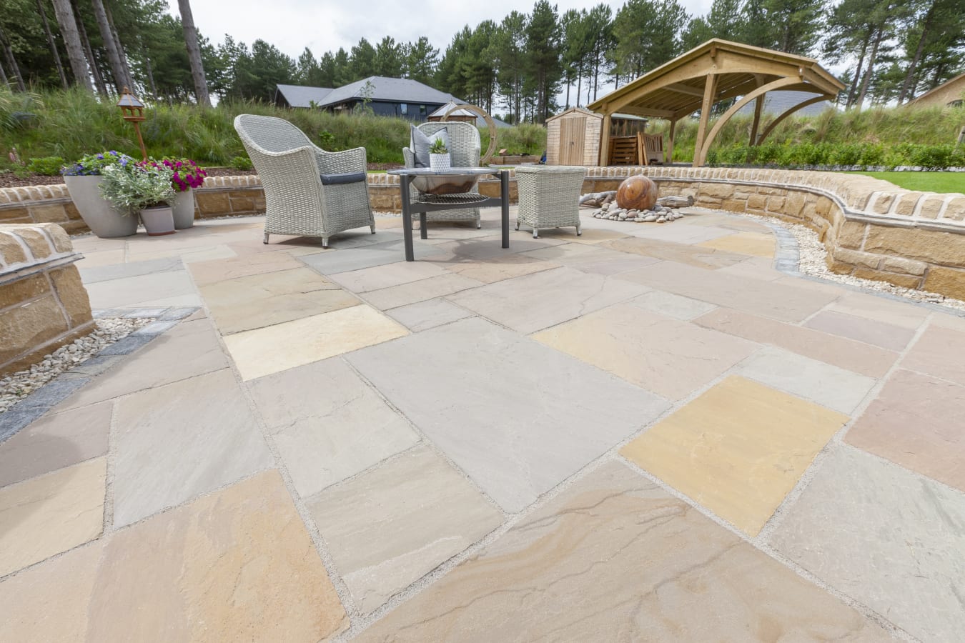 A recently installed Indian stone buff coloured paving area