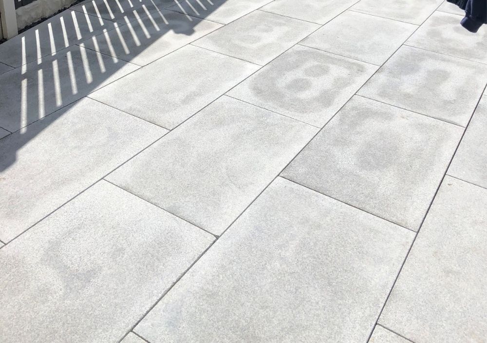 Light grey granite paving
