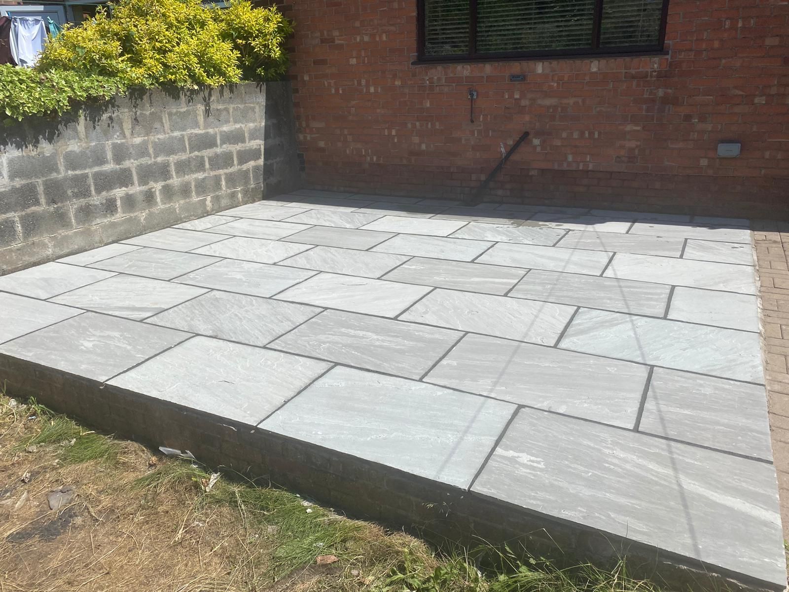 large light grey Indian stone paving area