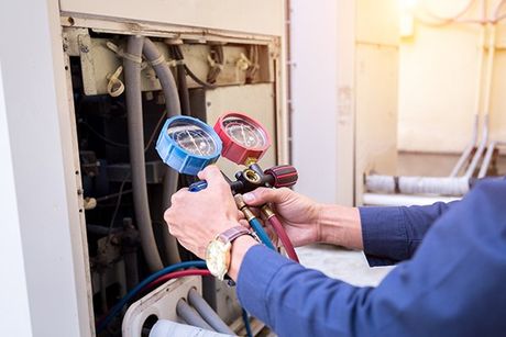 Technician Checking Air Conditioner — Alexandria, AL — Valley Heating & Cooling
