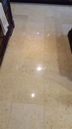 A close up of a tiled floor in a bathroom.