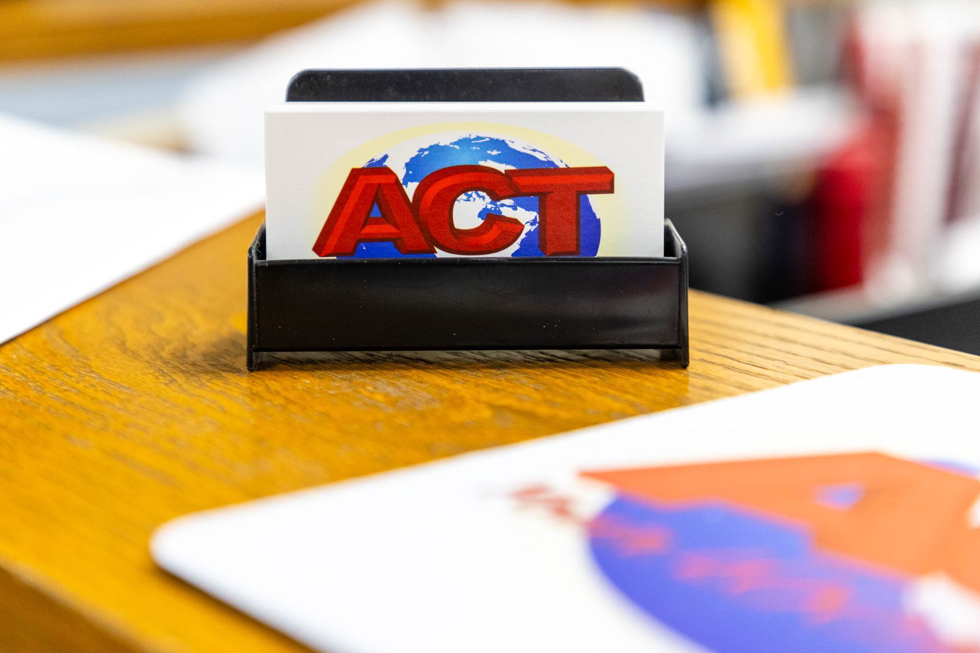 Business card holder containing cards with a red