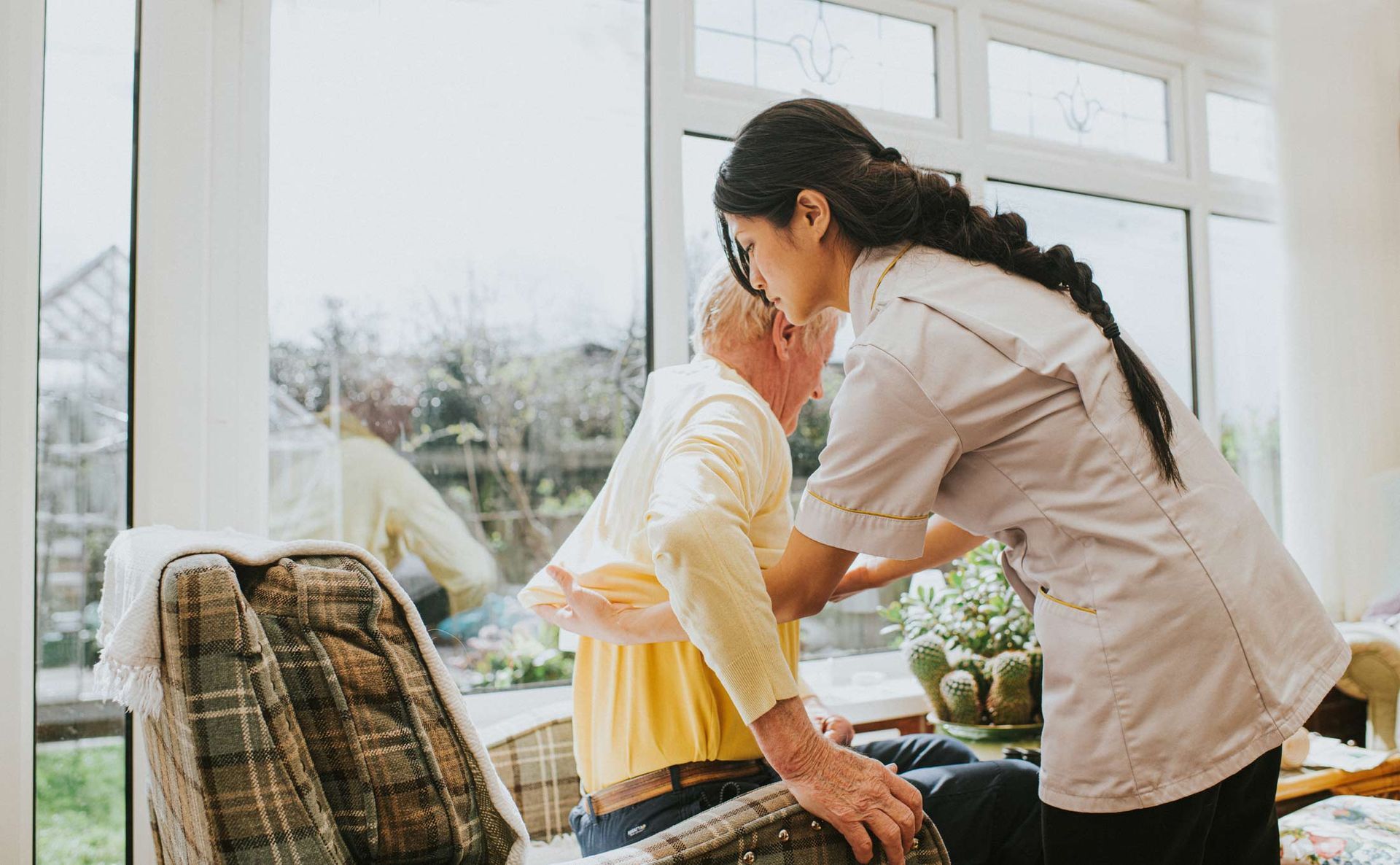 Female helps an elderly male | Adelaide, SA | Pristine Support Services