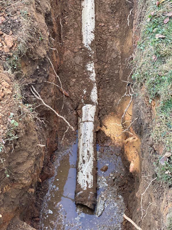 Muddy Trench with A Pipe