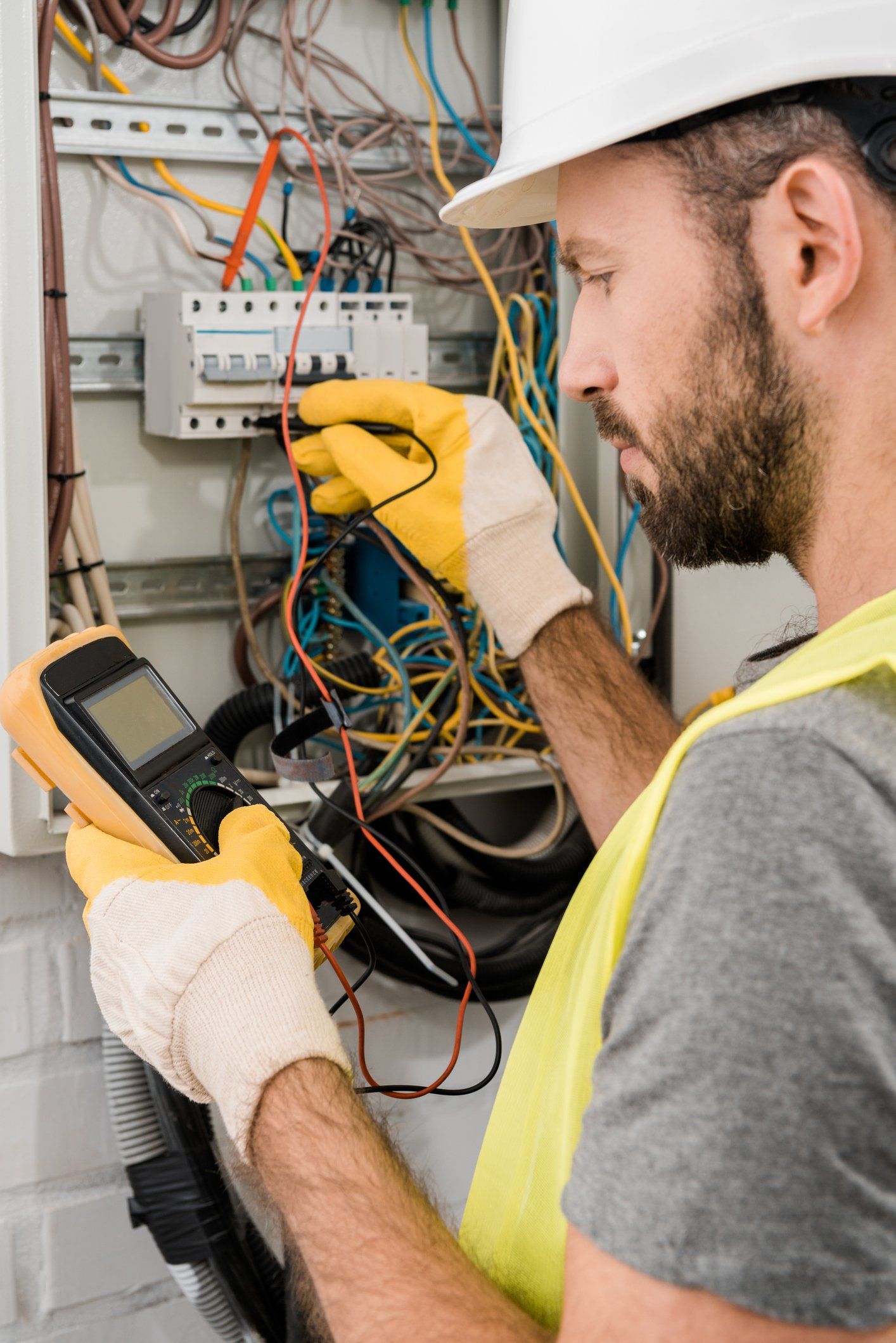 Residential Electrician —  Electrician Checking Electrical Box with Multimeter in Claymont, DE