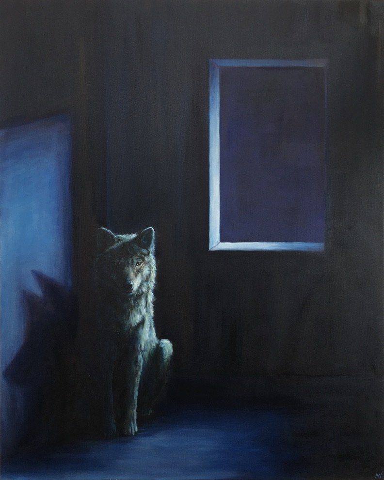 Wolf statue in a dark room illuminated by a blue glow from a window.