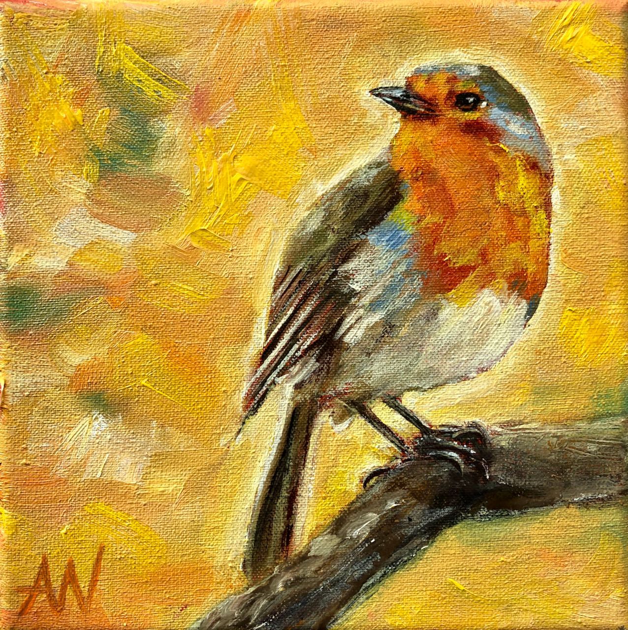European robin with orange breast perched on a branch, set against an abstract yellow background.
