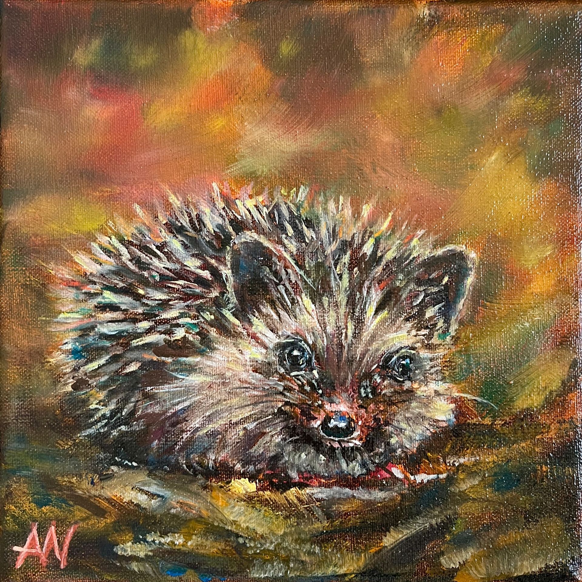 Hedgehog with spiky fur, sitting in autumn leaves. Brown, orange, and tan colors.