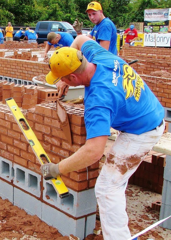 Man Building a Brick Wall — NC & SC — Tucker-Kirby Co.