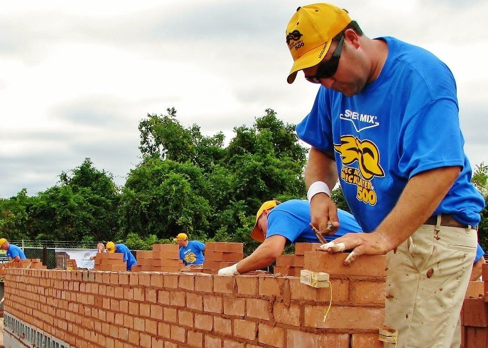Man Competing in a Brick Contest — NC & SC — Tucker-Kirby Co.